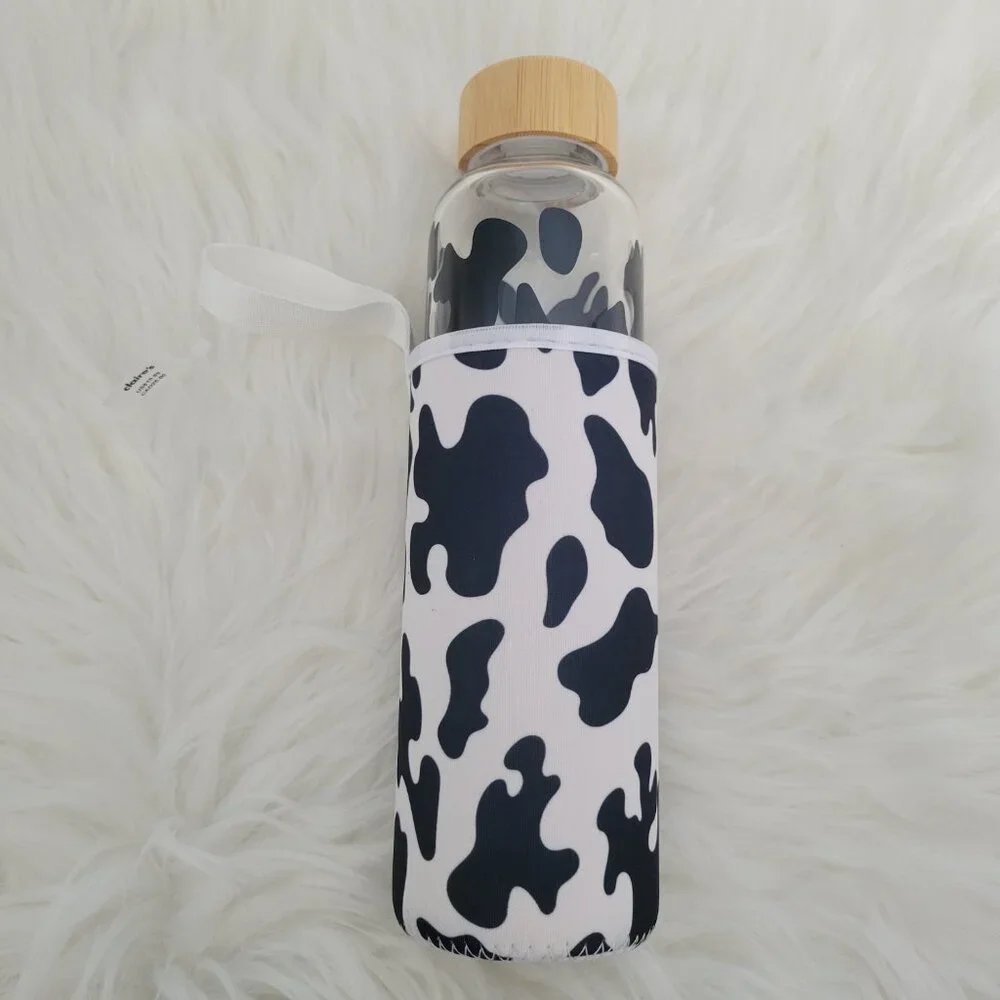 Claire's Cow Print Glass Water Bottle with Sleeve